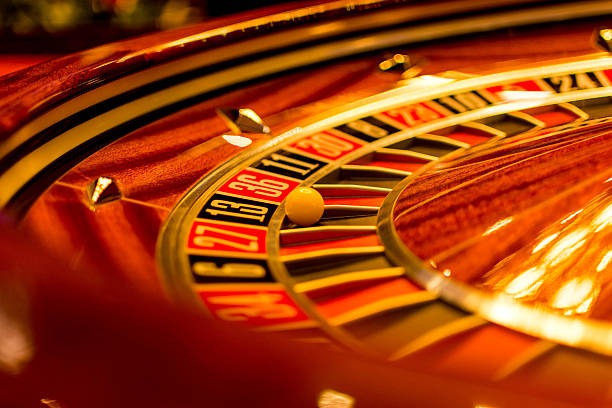 Close-up of playing cards and chip stack at Casino Hold'em table